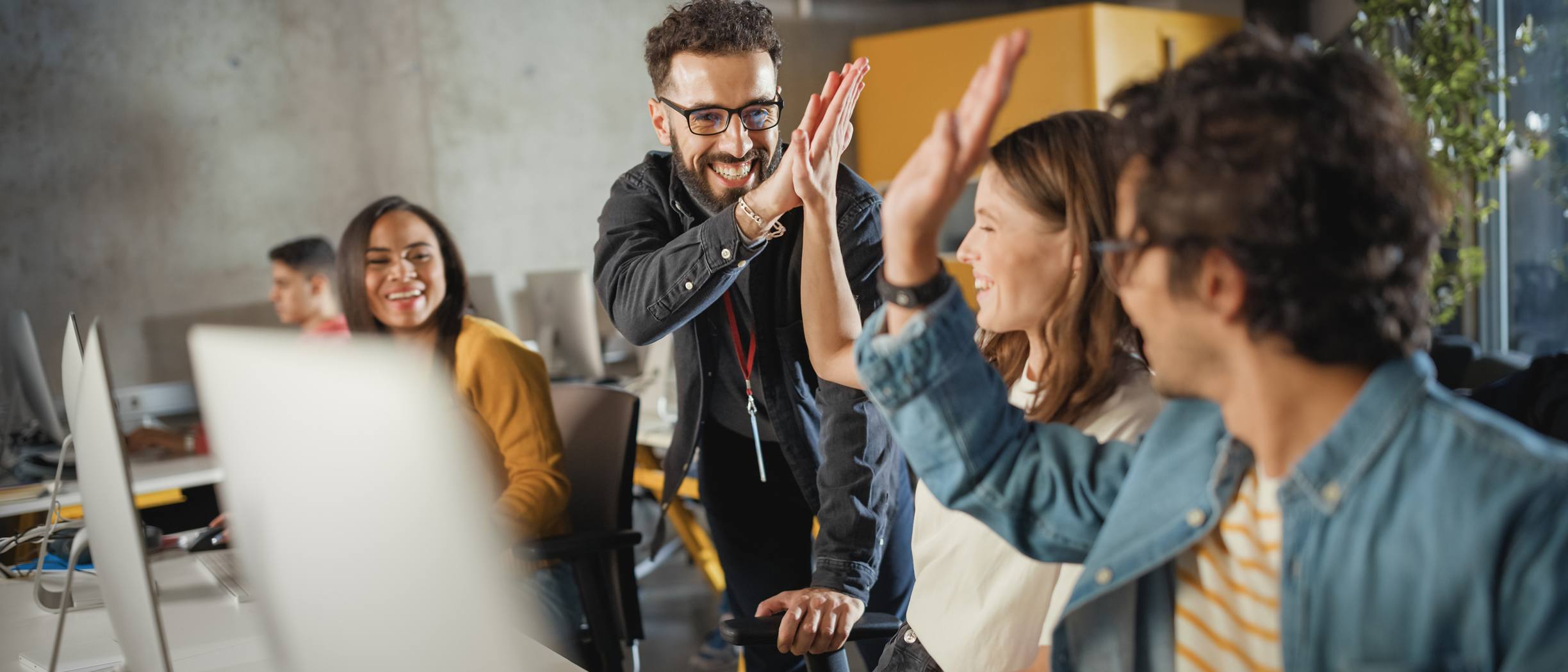 Tallink Training Centre participants celebrating a successful exercise in a classroom