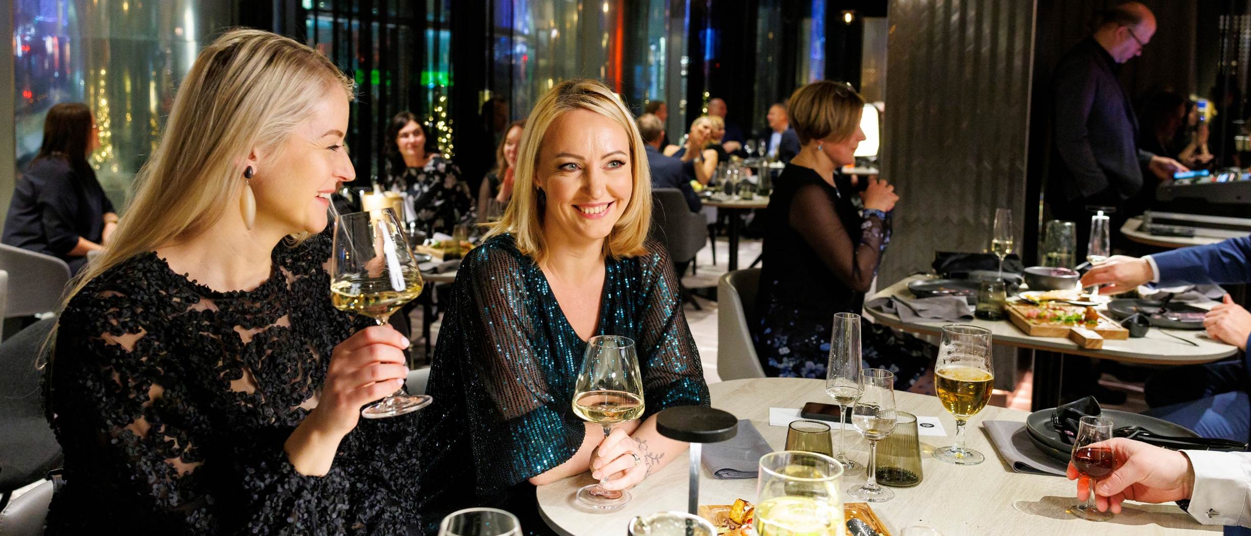 People enjoying a Christmas party at the City Grill House restaurant.