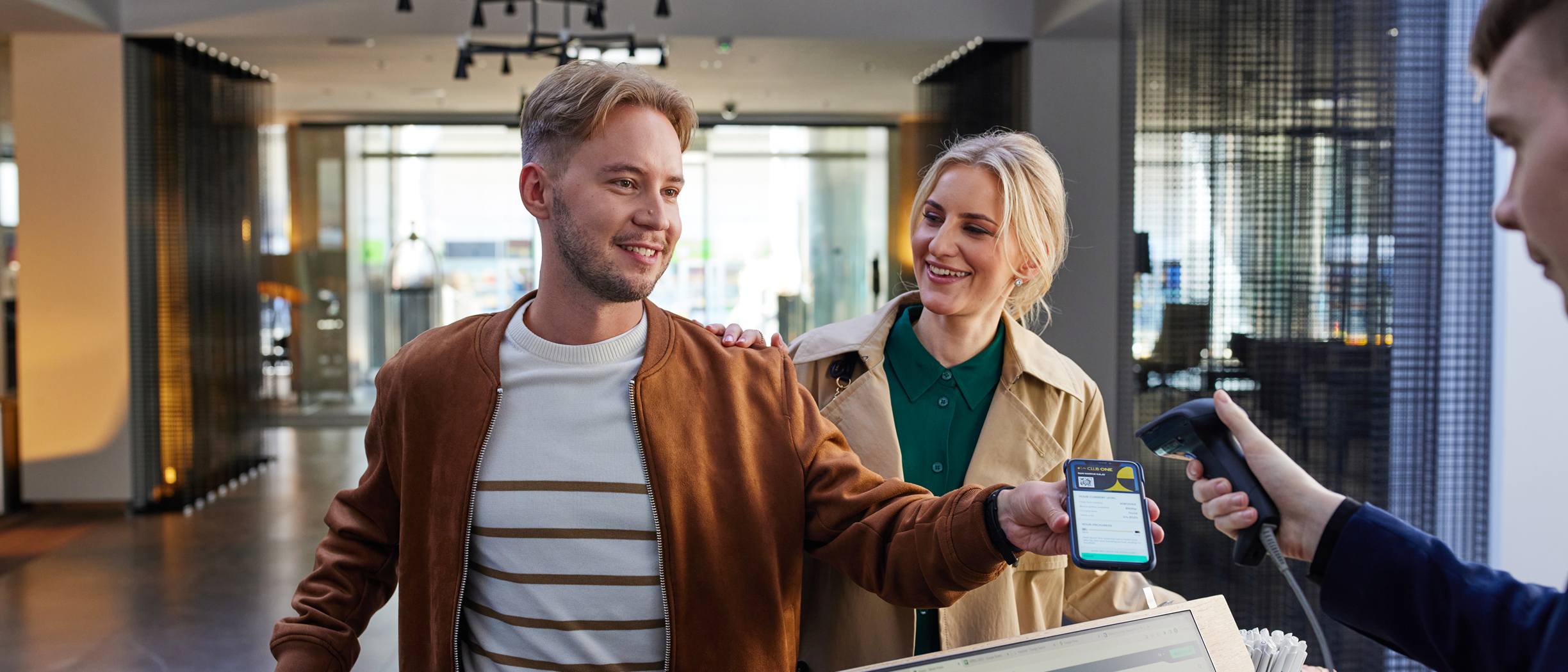 A man and a woman checking in at Tallink City Hotel