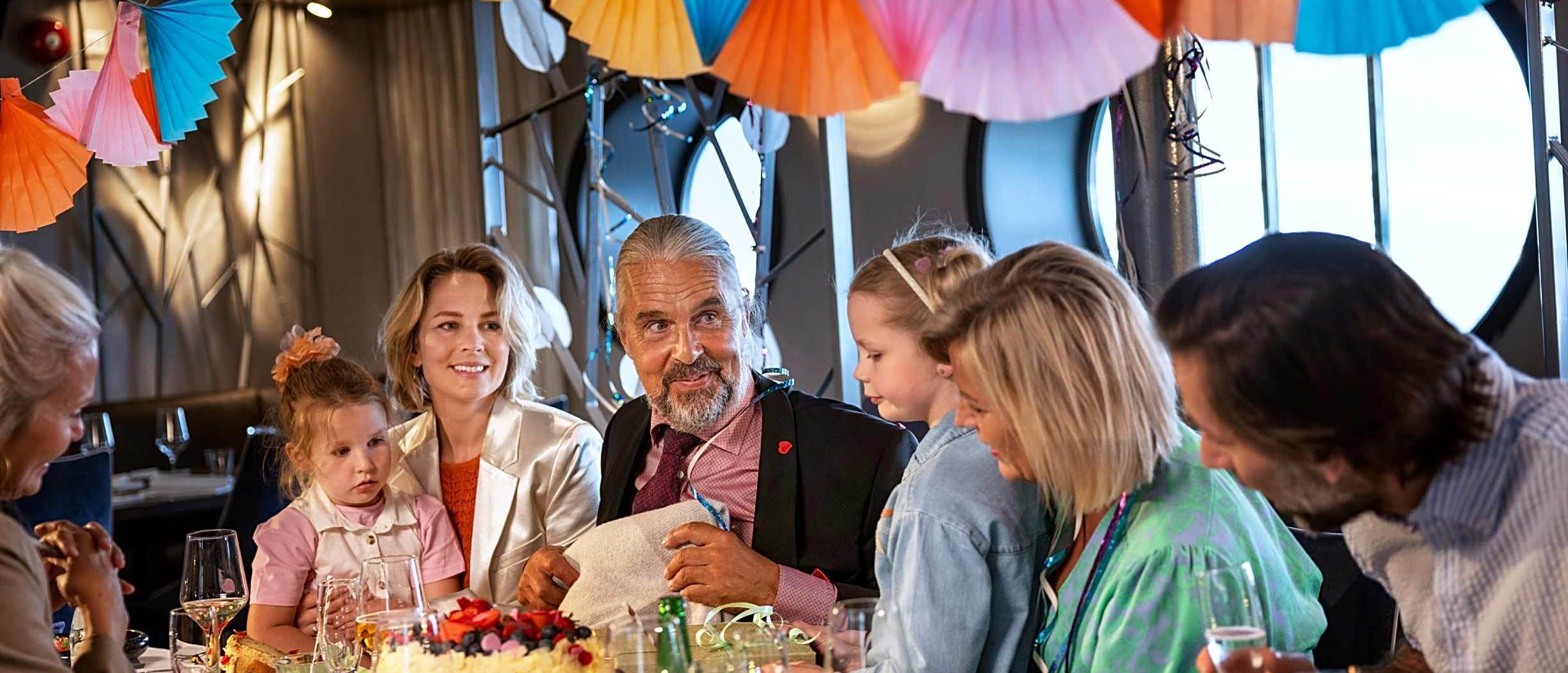 A Club One Family Group celebrating birthday onboard