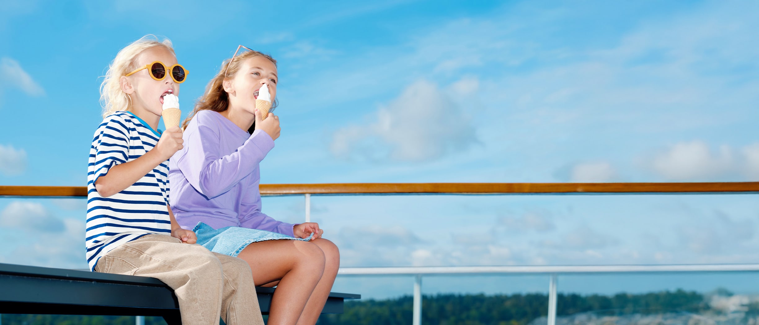 Two girls eating ice cream