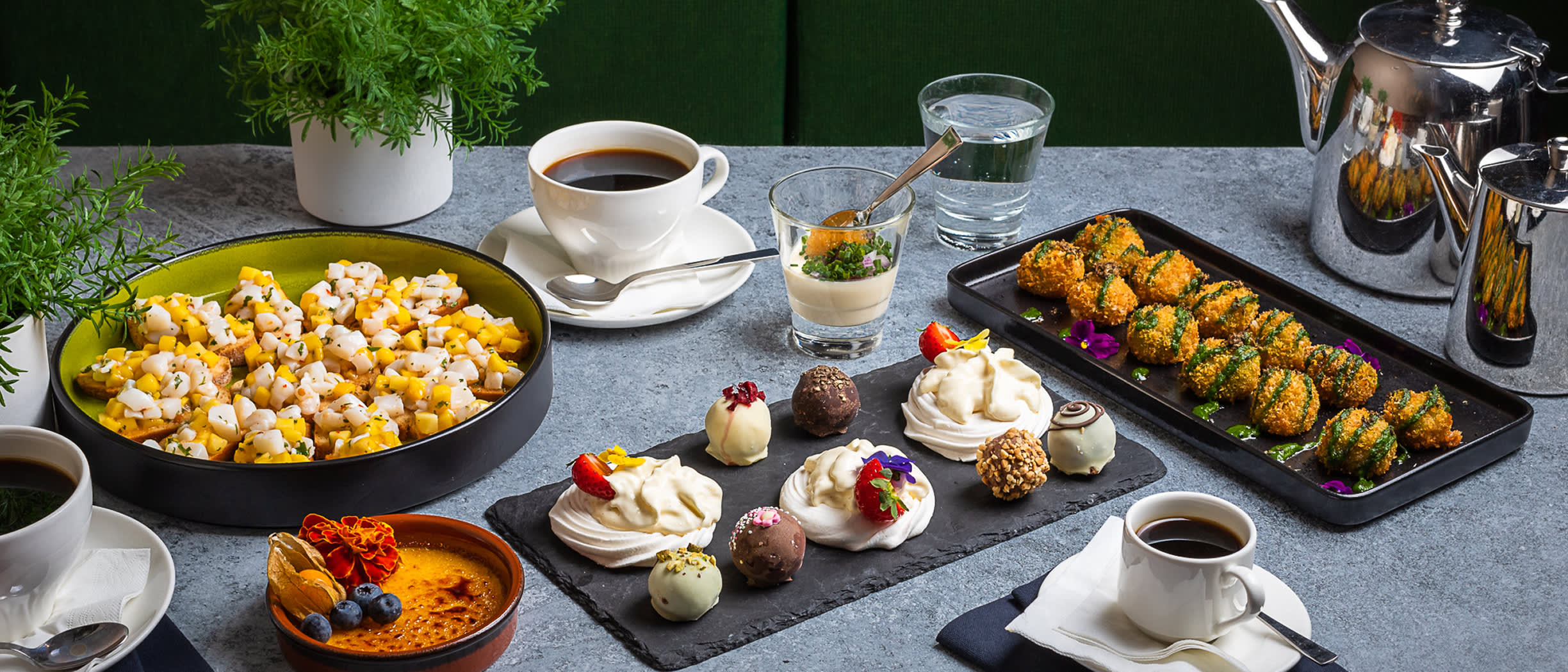 Selection of snacks, desserts and coffee from our Conference Menu – including savory bites, sweets and hot drinks served on board MyStar.
